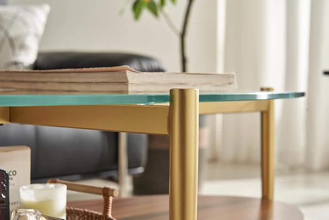 Shrine Oval Coffee Table, Mid-Century Modern Design, 2-Tier Structure, Clear Glass Top and Walnut MDF Shelf, 47" D x 21" W x 17" H, Sleek Conical Metal Legs with Gold Finish