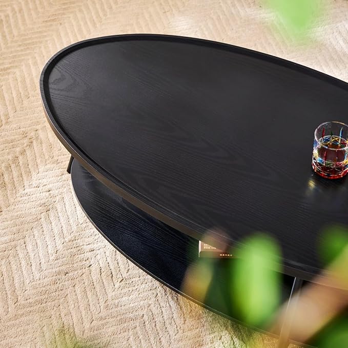 AGV Oval Coffee Table with Shelf Storage, 2-Tier Black Wood Finish Center Table for Living Room, Modern Asymmetrical Metal Legs, Raised Edge Sofa Table
