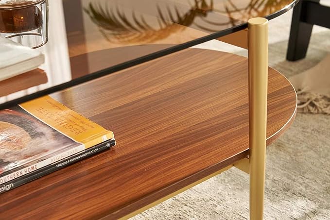 Shrine Oval Coffee Table, Mid-Century Modern Design, 2-Tier Structure, Amber Glass Top and Walnut MDF Shelf, 47" D x 21" W x 17" H, Sleek Conical Metal Legs with Gold Finish