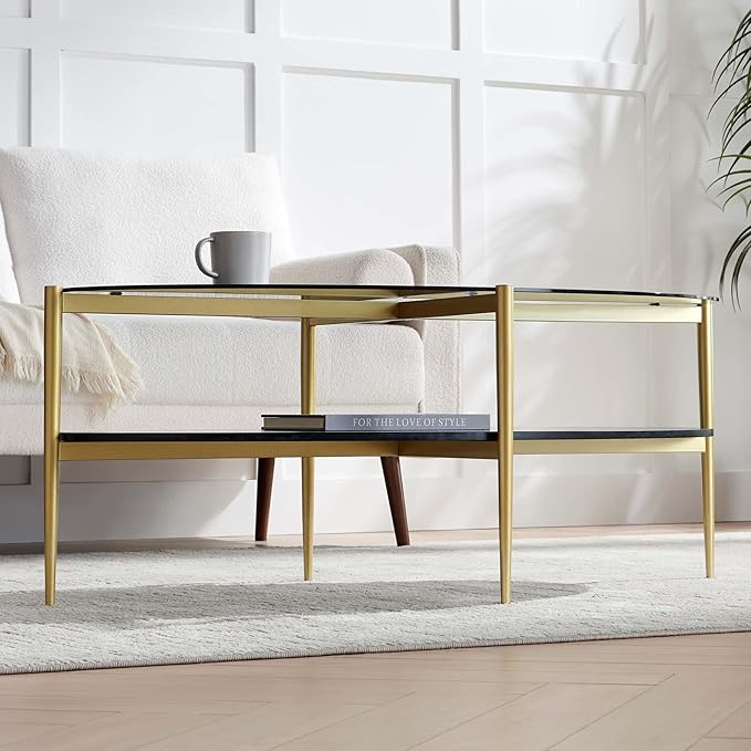 Oval Glass Coffee Table, Mid-Century Modern Design, L43 x W22 x H17 inch, Surfboard Shaped Grey Glass Top and Black Marble Finish Wood Shelf, Tapered Legs with Gold Finish Frame