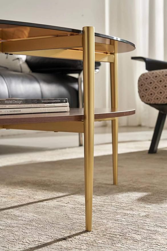Shrine Oval Coffee Table, Mid-Century Modern Design, 2-Tier Structure, Amber Glass Top and Walnut MDF Shelf, 47" D x 21" W x 17" H, Sleek Conical Metal Legs with Gold Finish