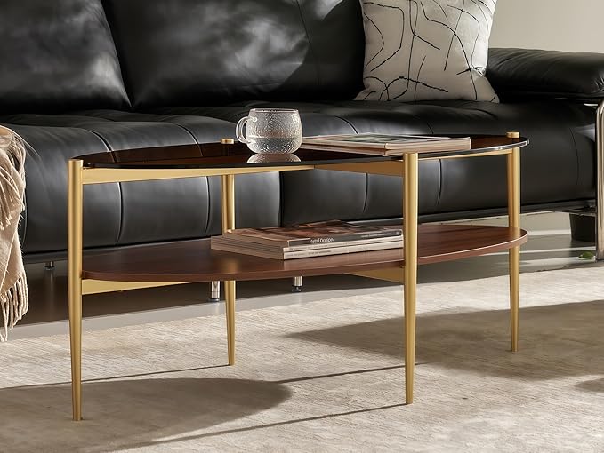 Shrine Oval Coffee Table, Mid-Century Modern Design, 2-Tier Structure, Amber Glass Top and Walnut MDF Shelf, 47" D x 21" W x 17" H, Sleek Conical Metal Legs with Gold Finish
