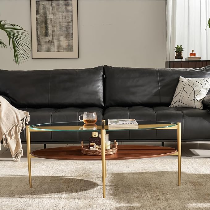 Shrine Oval Coffee Table, Mid-Century Modern Design, 2-Tier Structure, Clear Glass Top and Walnut MDF Shelf, 47" D x 21" W x 17" H, Sleek Conical Metal Legs with Gold Finish