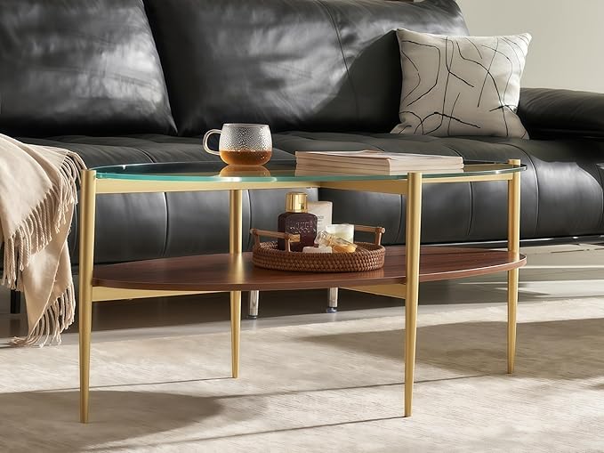 Shrine Oval Coffee Table, Mid-Century Modern Design, 2-Tier Structure, Clear Glass Top and Walnut MDF Shelf, 47" D x 21" W x 17" H, Sleek Conical Metal Legs with Gold Finish