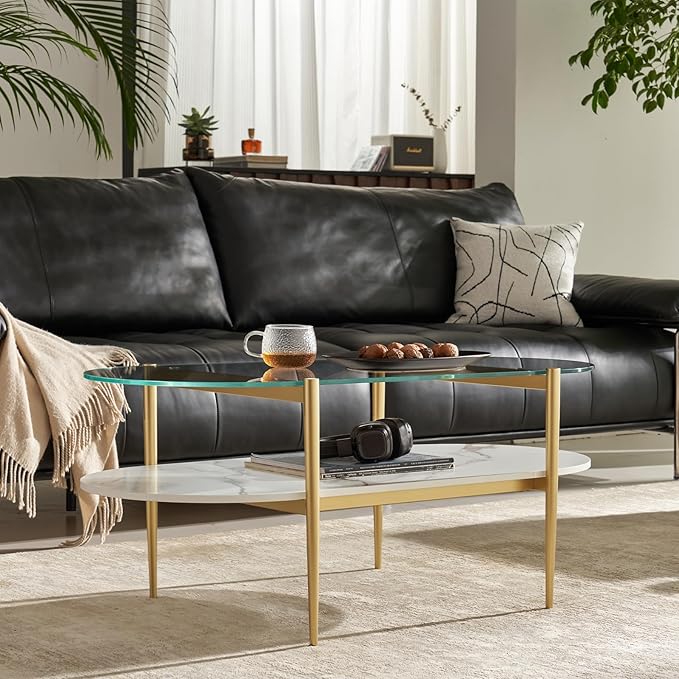 Shrine Oval Coffee Table, Mid-Century Modern Design, 2-Tier Structure, Clear Glass Top and White MDF Shelf, 47" D x 21" W x 17" H, Sleek Conical Metal Legs with Gold Finish
